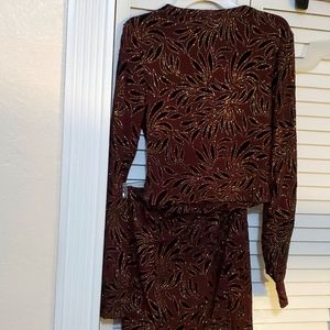 Never worn, 2-piece burgundy dress. Glitter printed. Size Small.